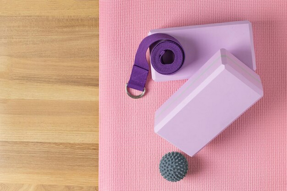 a yoga mat, yoga belt, and yoga blocks